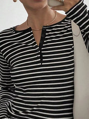 white henley featuring buttoned and striped