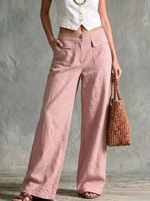 Pink linen wide-leg pants with flap pockets and a high waist.