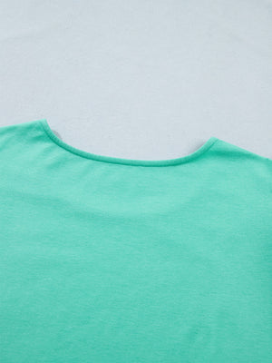 Eyelet lace ruffled cap sleeve top in mint green with a wide neckline.