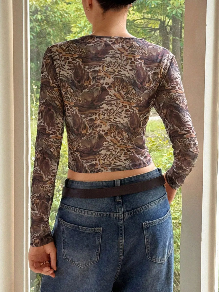 Brown sheer leopard print long-sleeve crop top with a round neckline.