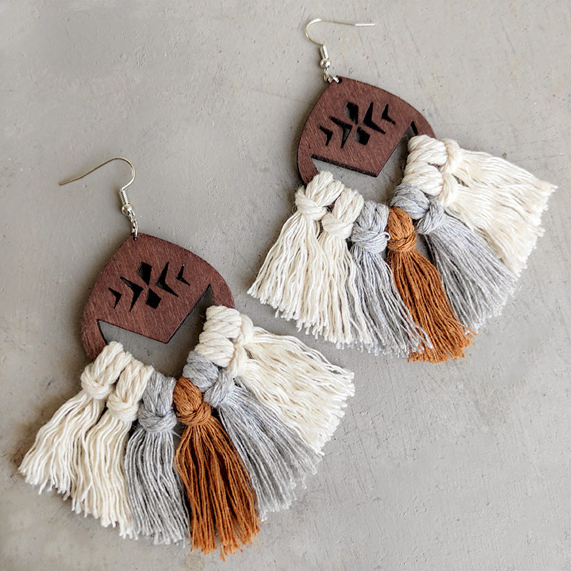 Geometric macrame tassel earrings with wood detail in cream, grey, and brown.