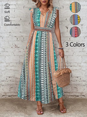 Bohemian maxi dress with ruffle sleeves, V-neck, smocked waist, and a colorful tribal print.