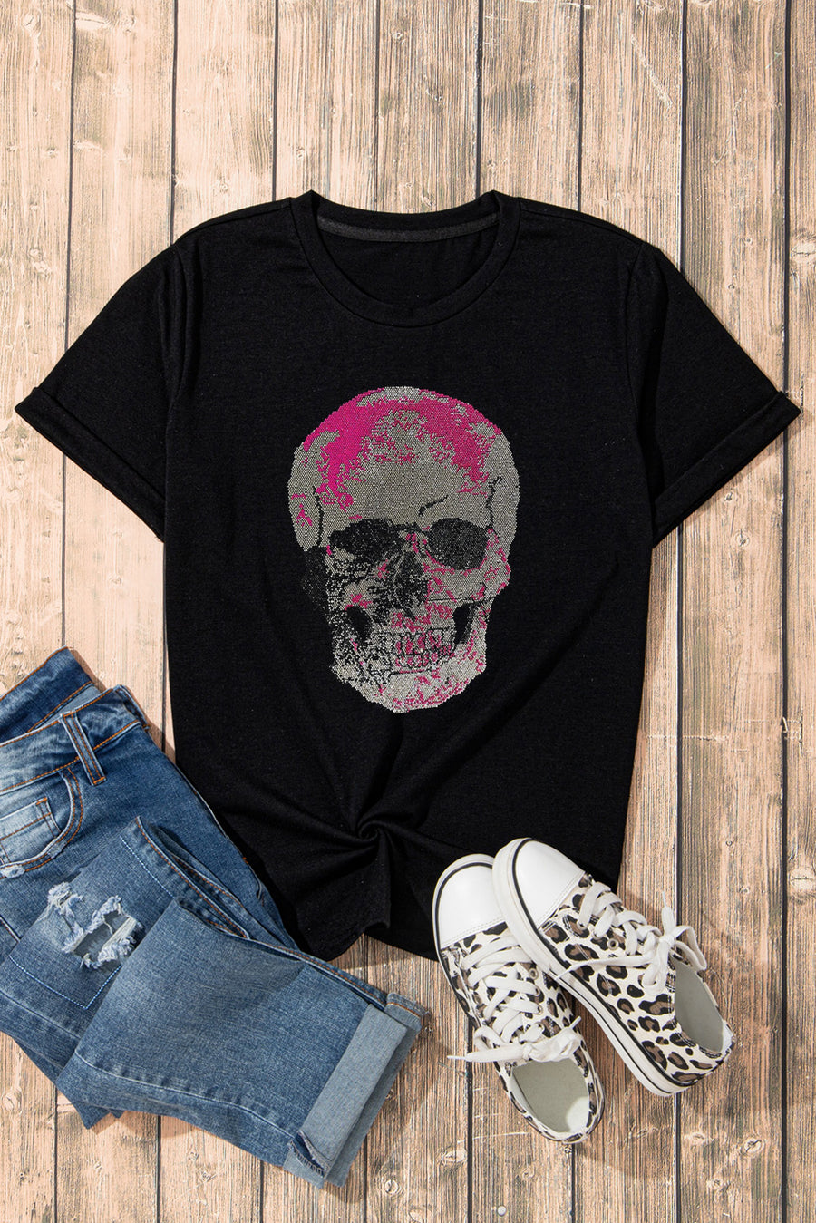 Black cotton blend t-shirt with a pink and gray pixel skull graphic.