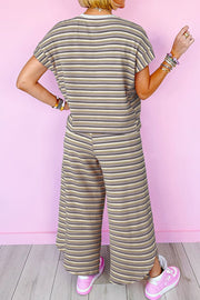 Cotton culotte jumpsuit with rainbow stripes and drawstring waist.