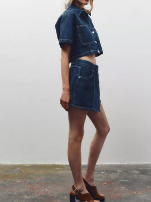 Dark blue cotton cropped button-up top and skort set with contrast stitching.
