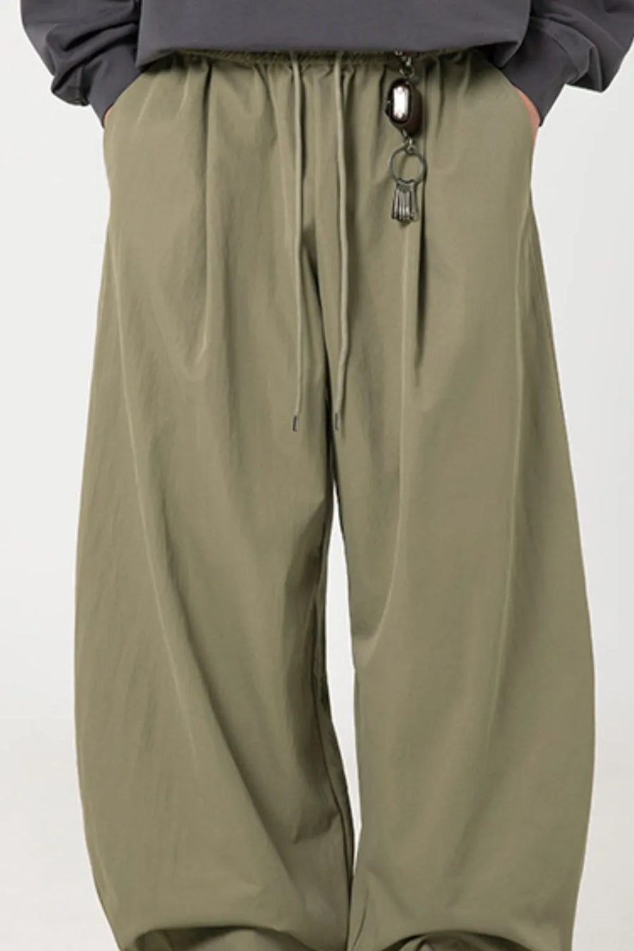 Sage balloon-fit drawstring trousers with a relaxed casual style.