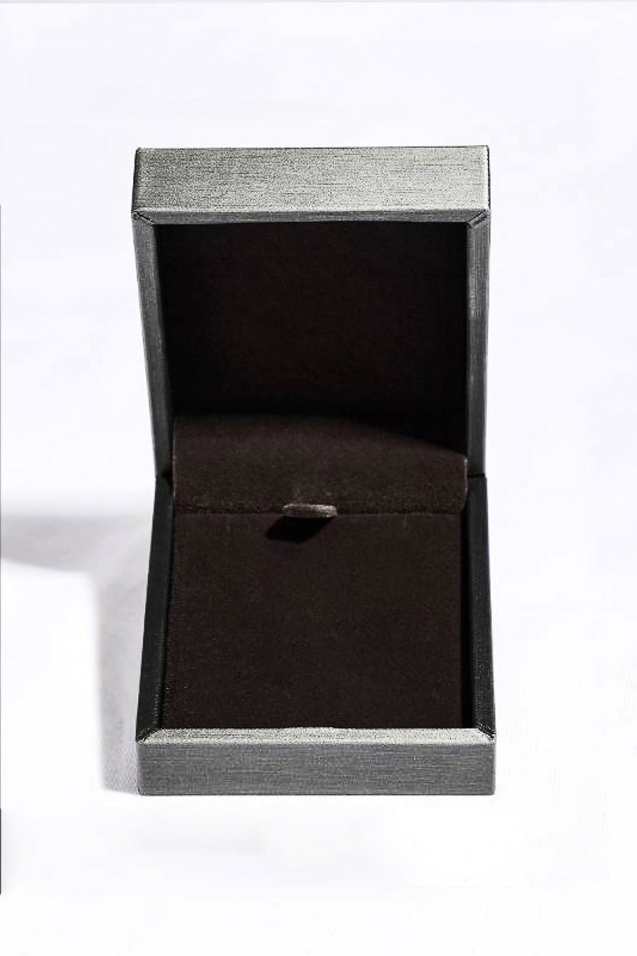 Open jewelry box with gray textured exterior and dark interior.