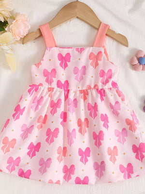 Pink baby dress with bow print and ruffled hem.