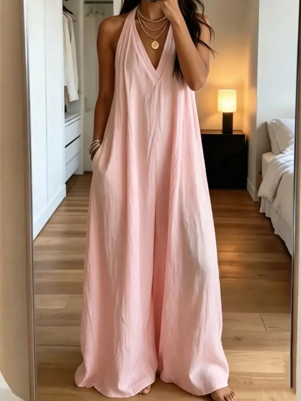 jumpsuit in blush pink featuring pocketed and relaxed fit