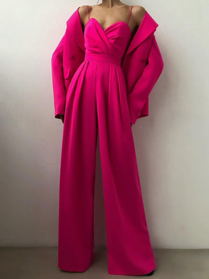 Ruched spaghetti strap wide-leg jumpsuit in Rose Red with a draped bodice and flowing pants.