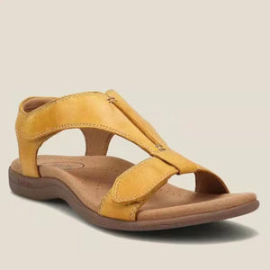 Yellow leather T-strap comfort sandals with adjustable straps and a contoured footbed.
