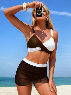 Two-piece bikini with brown and white twisted cami top and brown sheer skort with white waistband.