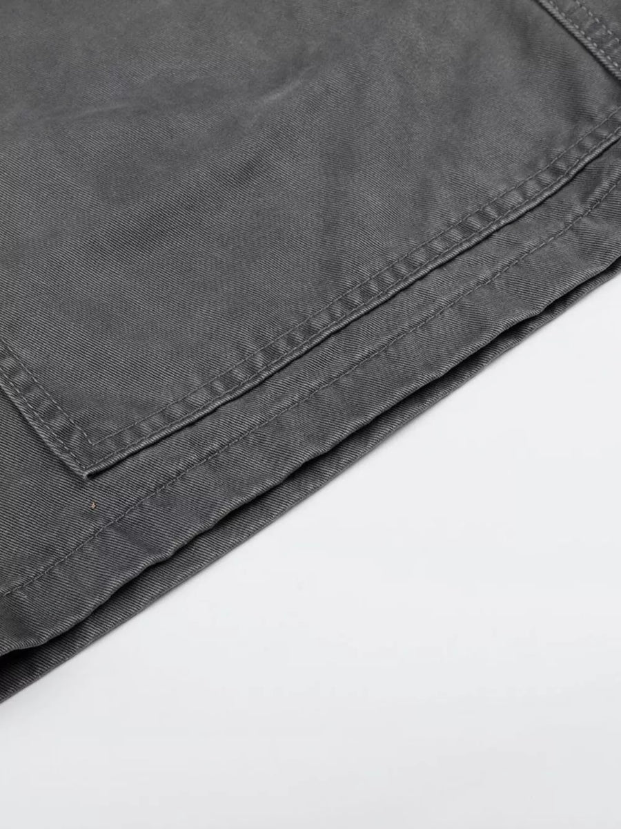 Men's grey cotton cargo capris with visible stitching detail on pocket.