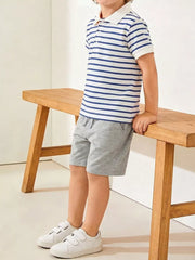 Boys' blue and white striped polo shirt and grey cotton shorts ensemble.