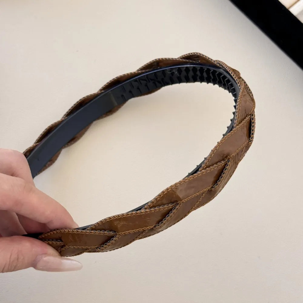 Woven faux leather headband in camel with braided detail