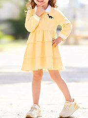 shirt dress in light yellow featuring tiered and A-line fit