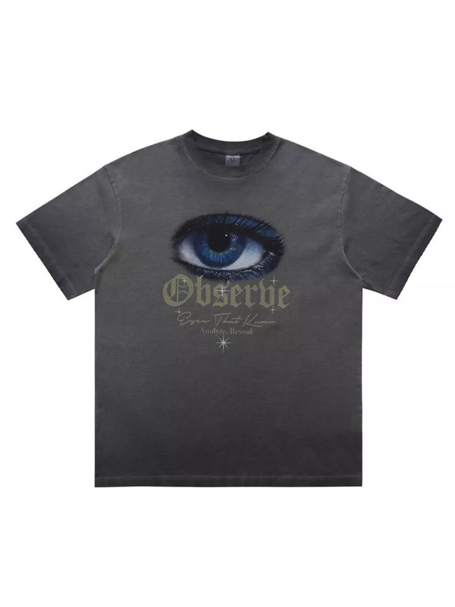 Grey graphic t-shirt with an eye print and text that says Observe