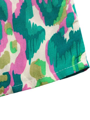 Maternity maxi dress with abstract print in pink, green, and cream.