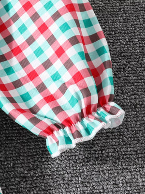Festive plaid dress sleeve with ruffled cuff in multicolor.