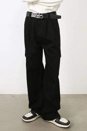Black pleated cargo denim trousers with a relaxed fit and side pockets.
