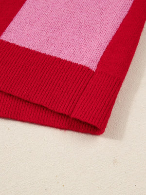 Checkerboard knit cardigan in deep rose and pink with ribbed hem detail.