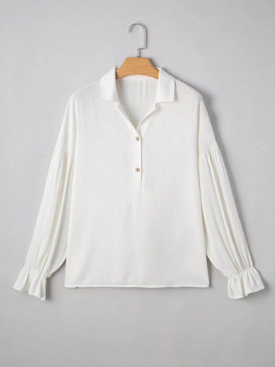 White long sleeve peasant blouse with ruffled cuffs and button detail