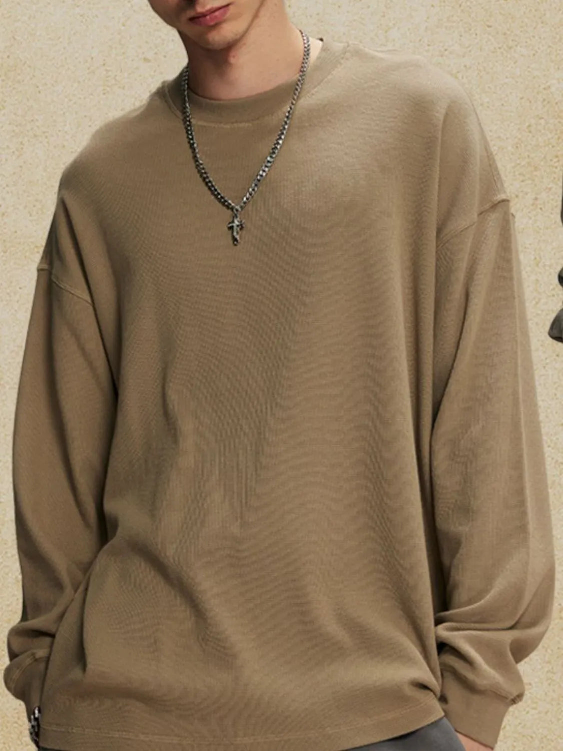 Oversized drop shoulder crewneck sweatshirt in khaki with a crew neckline and long sleeves.
