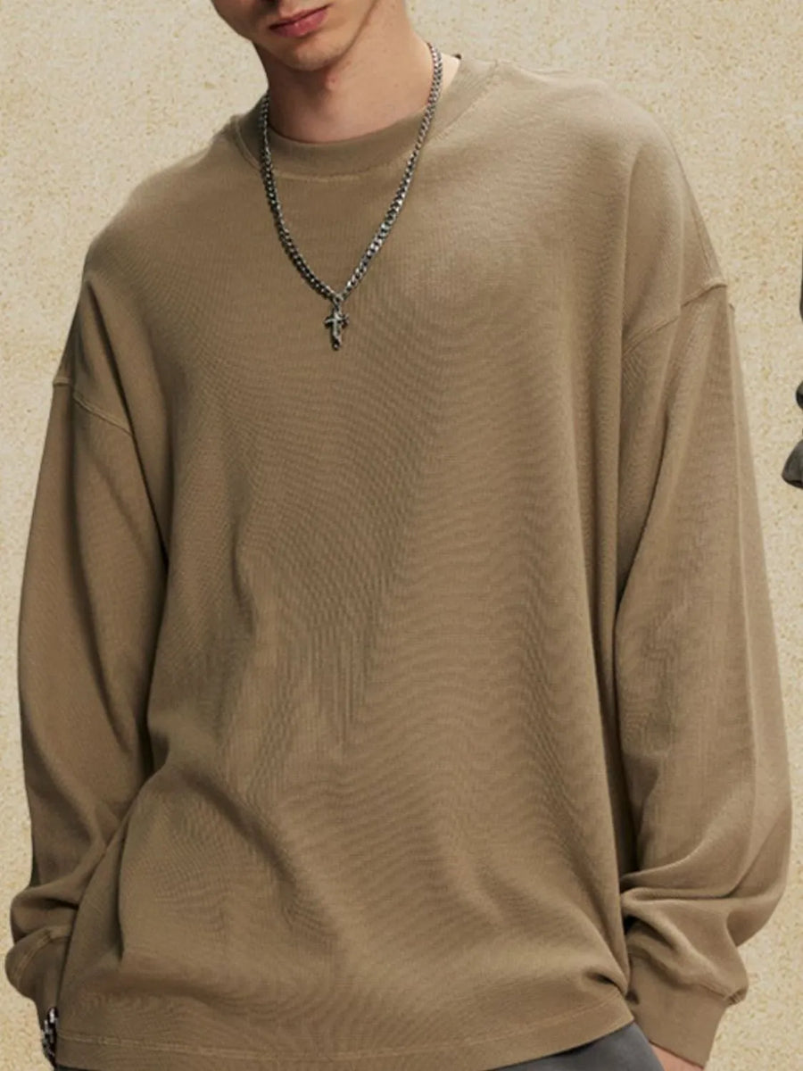 Oversized drop shoulder crewneck sweatshirt in khaki with a crew neckline and long sleeves.