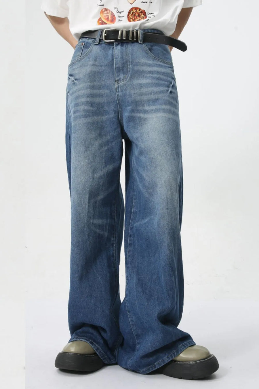 Oversized denim palazzo trousers in medium wash with a relaxed fit and wide leg.