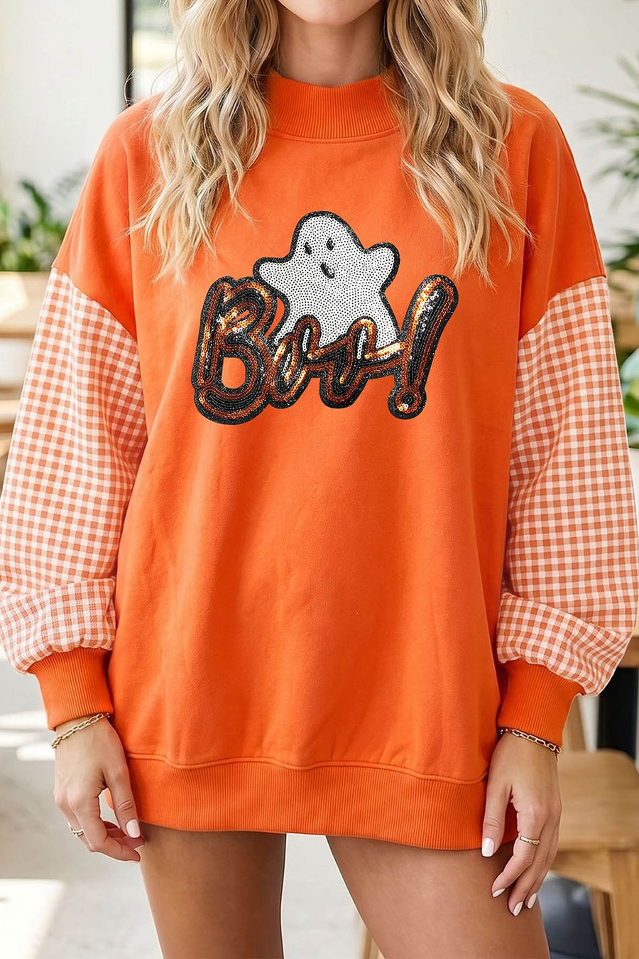 white sweatshirt featuring sequin embellishment and gingham, sequin