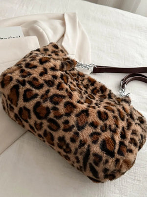 Leopard print faux fur shopper bag with chain handle and brown leatherette strap.