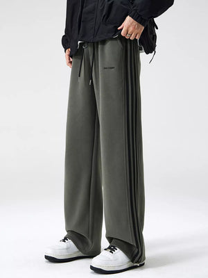 Men's army green sweatpants with black side stripes and drawstring waist