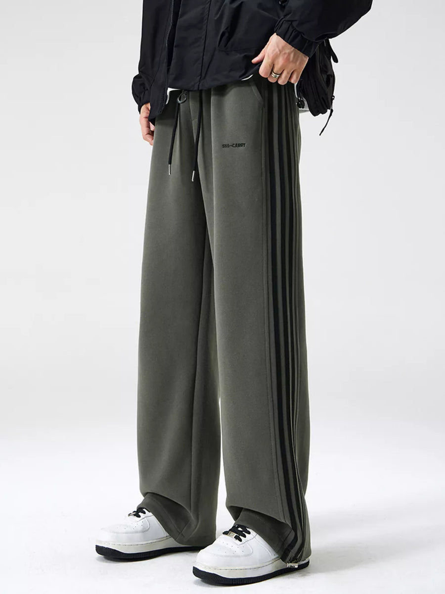 Men's army green sweatpants with black side stripes and drawstring waist