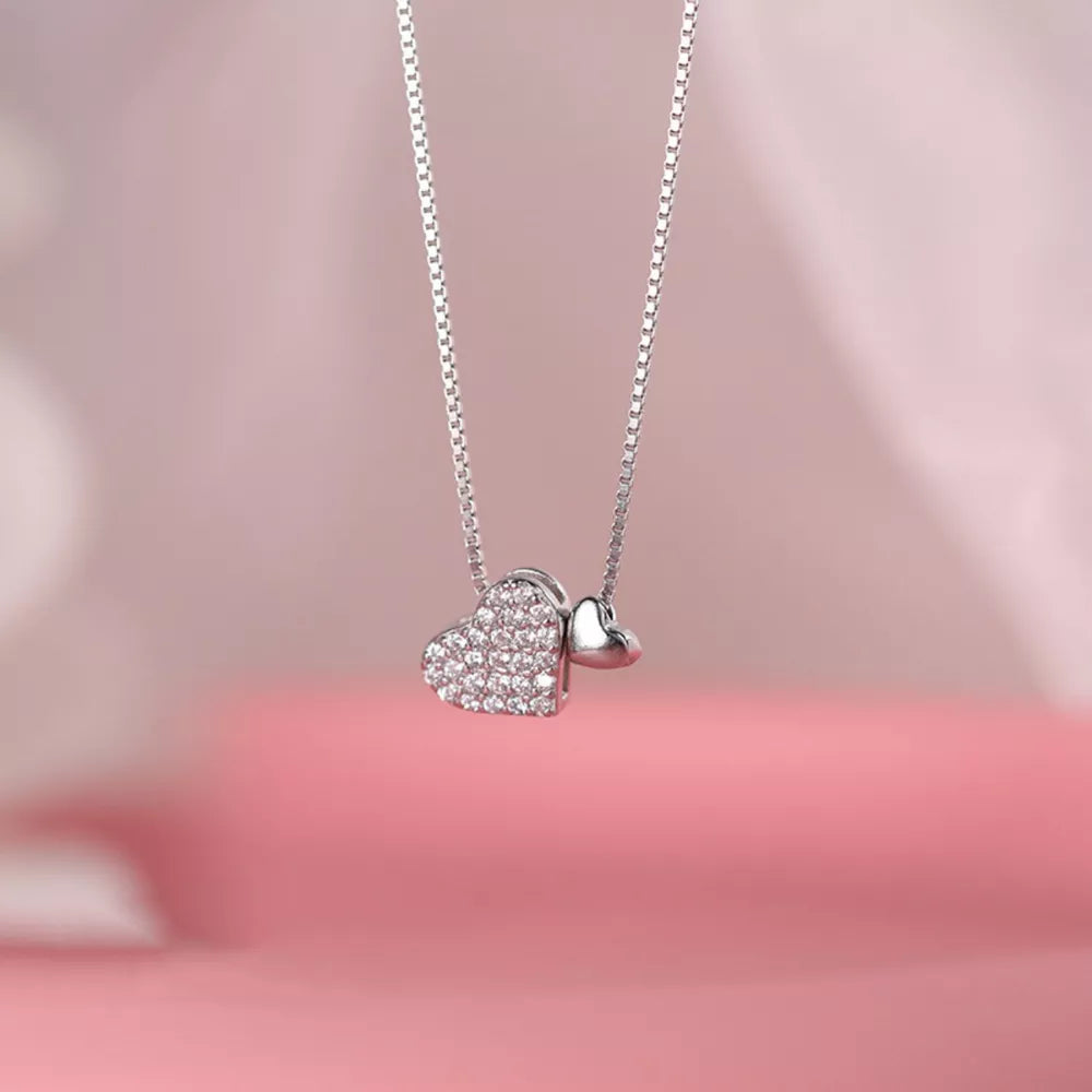 Elegant heart pendant necklace with pave zircon detail on sterling silver box chain