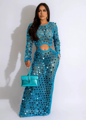 Blue sequin mesh cutout maxi dress with long sleeves and a crew neck.