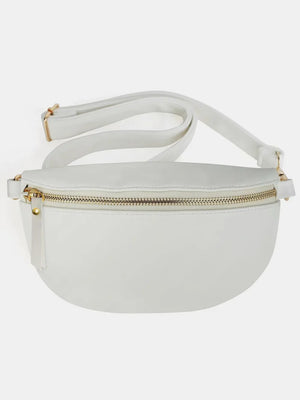 White faux leather curved zip belt bag with gold hardware and adjustable strap.