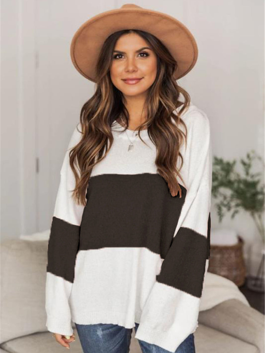 Colorblock knit pullover sweater with drop shoulder, black and white stripes, casual style.