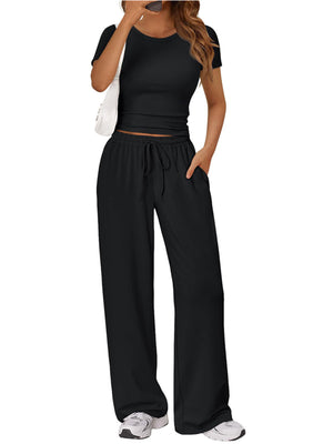 Black round neck tee and relaxed fit drawstring pants set with pockets.