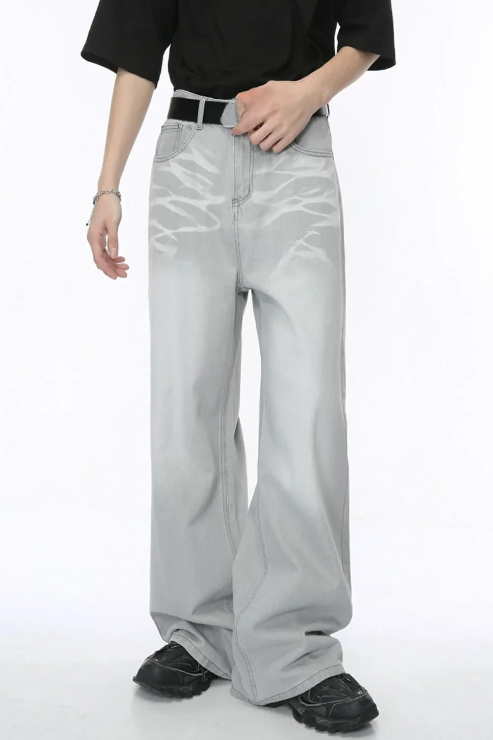 Light wash straight leg jeans with whiskered details and a relaxed fit.