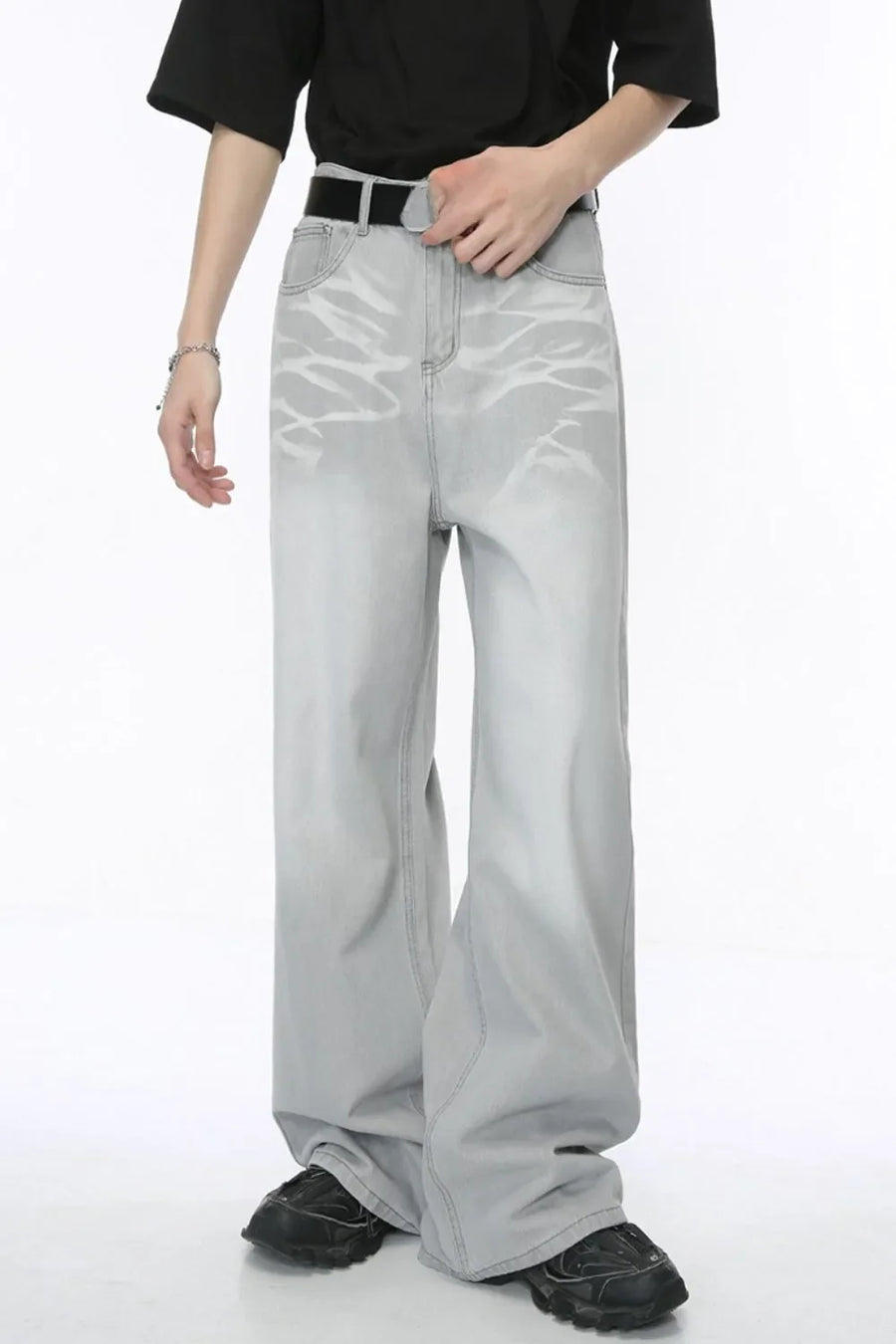 Light wash straight leg jeans with whiskered details and a relaxed fit.