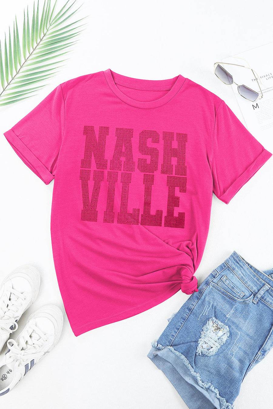 Hot pink t-shirt with rolled sleeves and Nashville graphic, tied at the waist