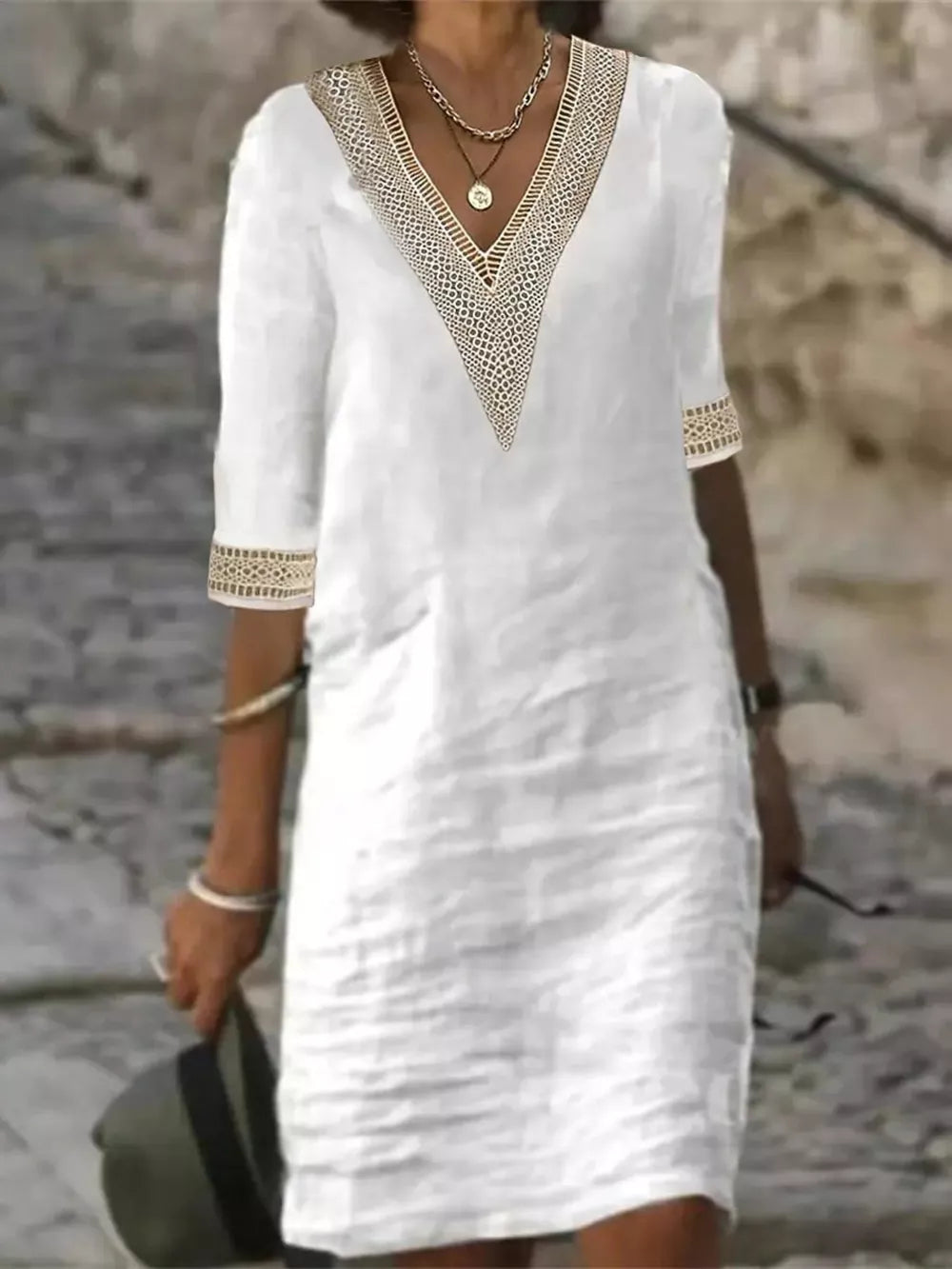 midi dress in white featuring lace detail and relaxed fit