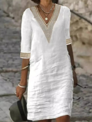 midi dress in white featuring lace detail and relaxed fit