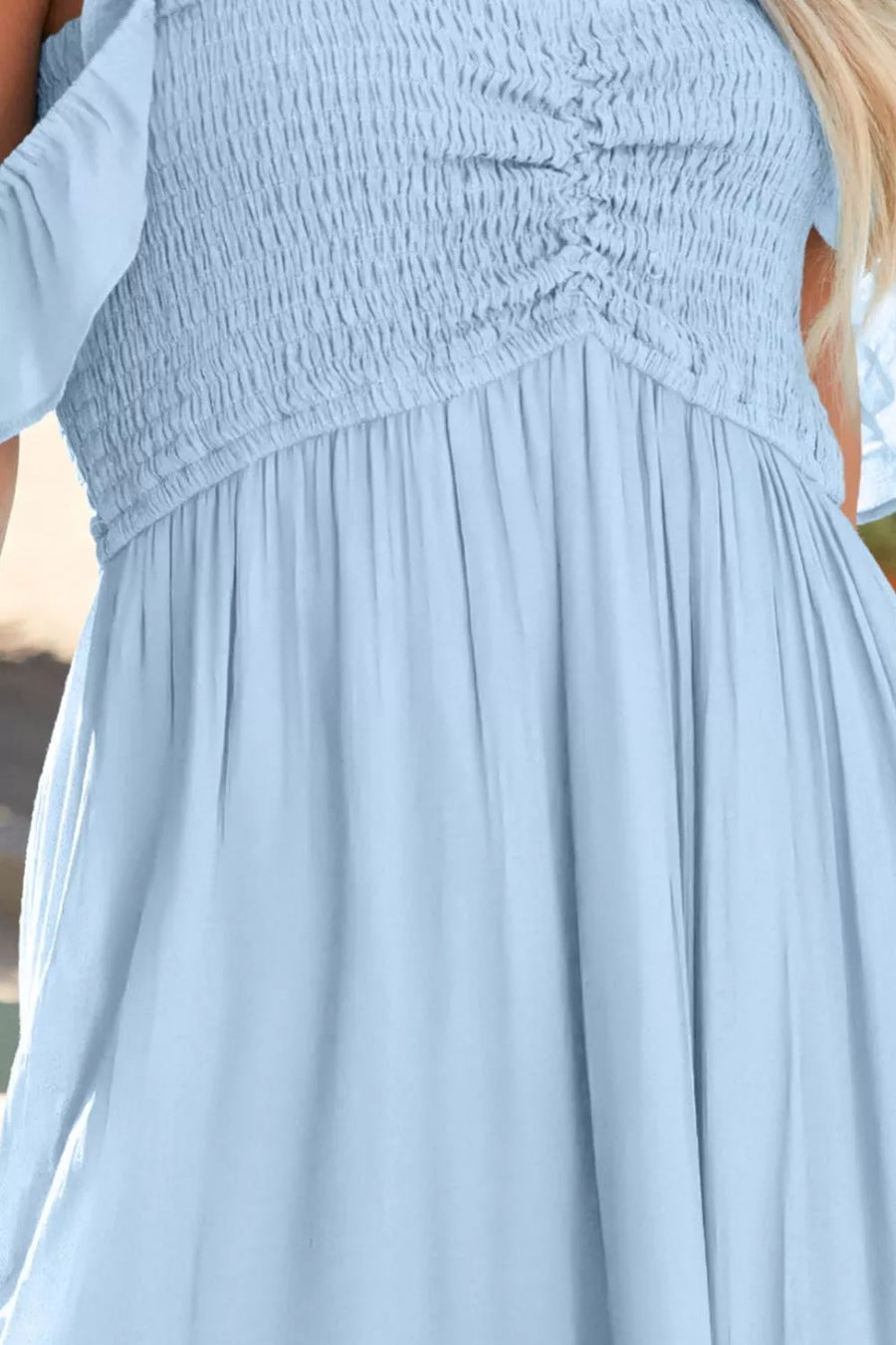 Light blue off-shoulder maxi dress with ruched bodice and flowy skirt
