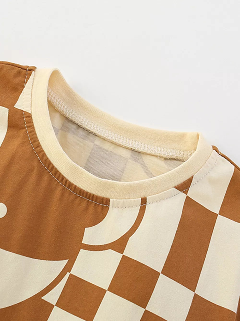 Toddler boys' brown and cream checkerboard bear graphic t-shirt with crew neck.