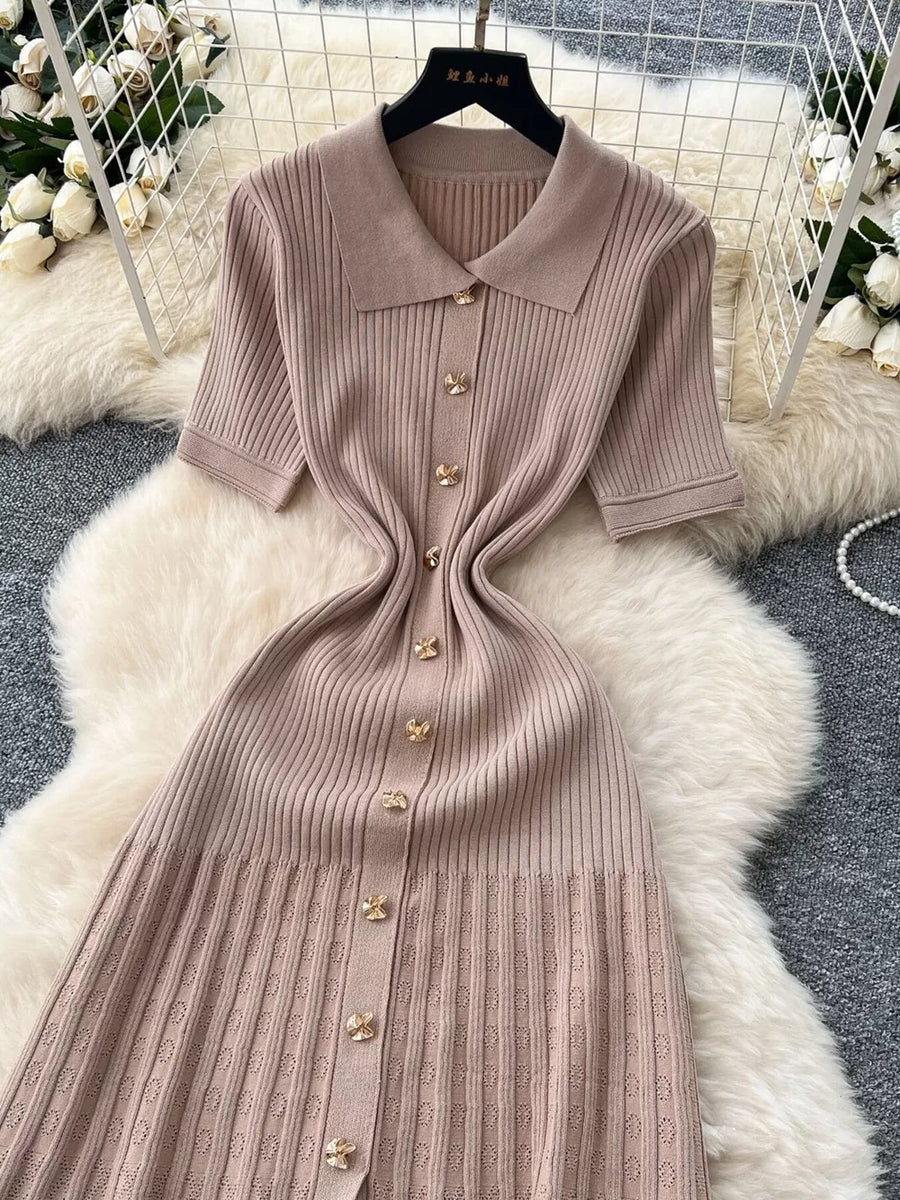 Apricot knit Peter Pan collar dress with gold buttons and short sleeves.