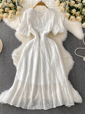 White embroidered puff sleeve midi dress with button front and A-line skirt