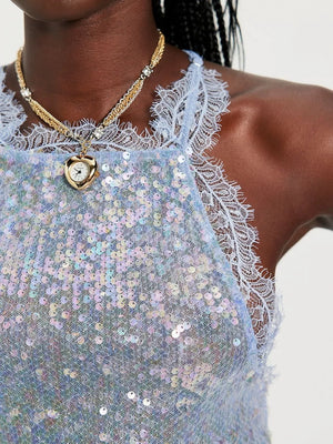 Blue sequin halter cami with lace trim and a heart pendant necklace.