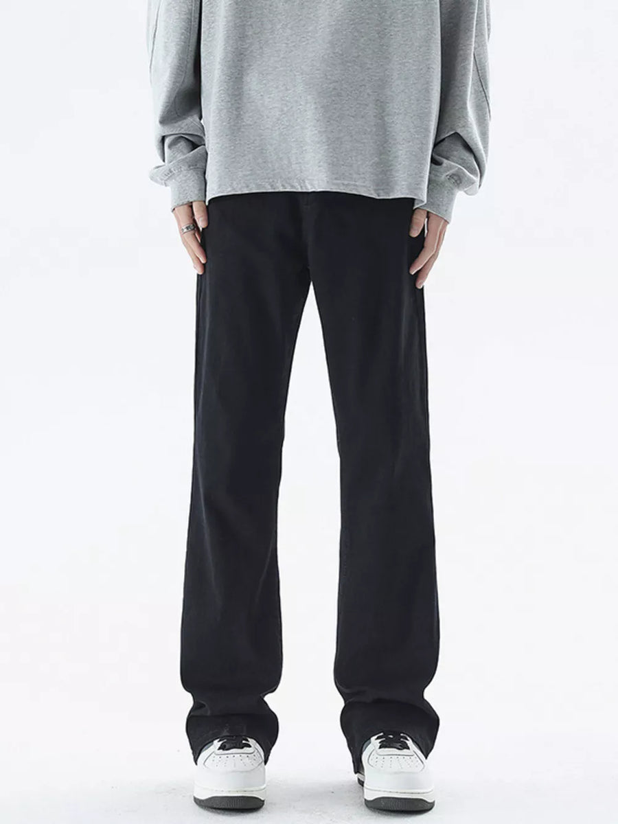 Black relaxed fit cotton jeans for men with a straight leg cut.