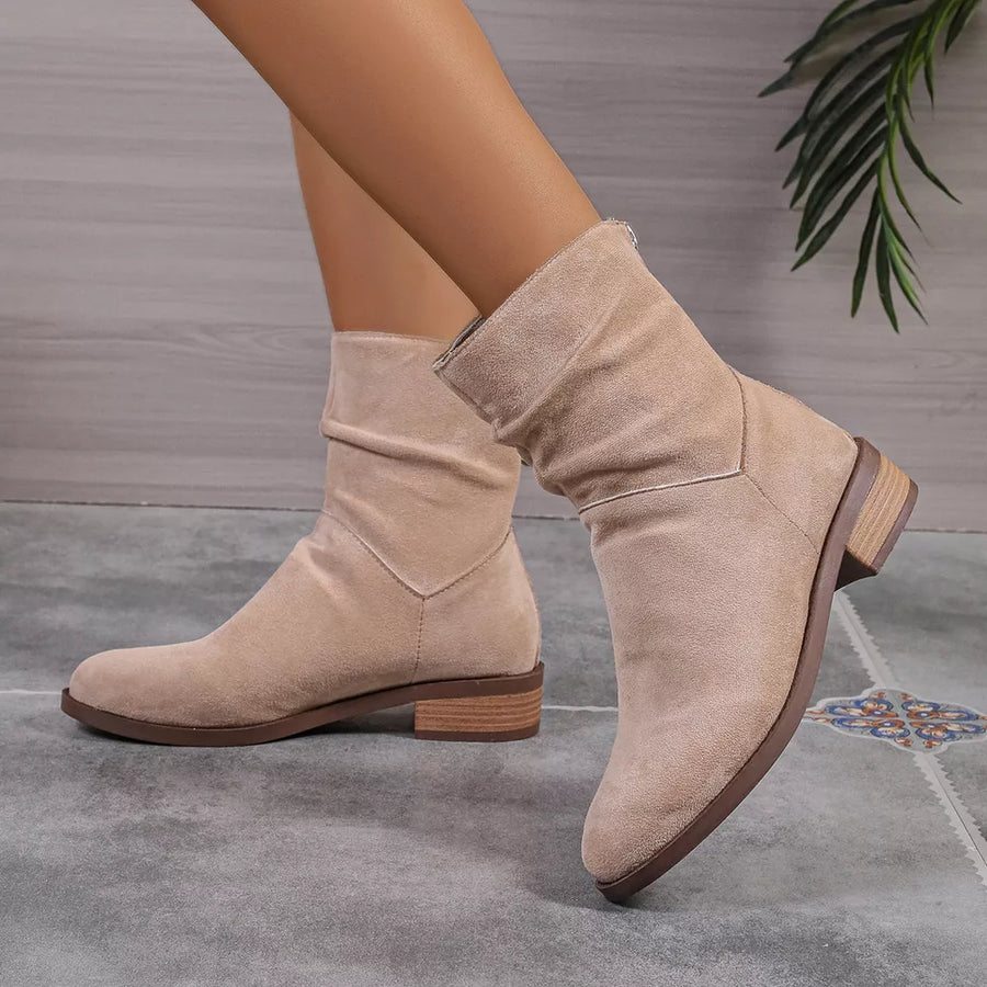 Khaki suede slouchy ankle boots with a block heel.